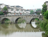 A Photo of a Bridge at Sanhe Ancient Town